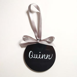 Each black acrylic ornament is a flat 4 inch round that can be personalized with a name or small phrase.  This sleek black is a classic style comes in your choice of ribbon and font colour.  4 inch round, 4mm thickness.