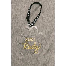 Load image into Gallery viewer, Clear paw shaped ornament with ruby written in gold hand lettering
