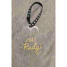 Load image into Gallery viewer, Clear paw shaped ornament with ruby written in gold hand lettering