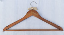 Load image into Gallery viewer, If you are looking for a perfect gift for your bridesmaid here is a custom hanger to accent her beautiful dress. Wood hangers are hand-lettered with the bridesmaid's name and the wedding date. "bridesmaid" is written in calligraphy on the centre of the hanger, and the bridesmaid's name and your wedding date in block lettering with your choice of gold or chrome font colour.