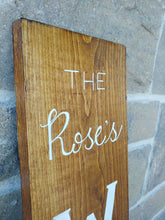 Load image into Gallery viewer, A personalized welcome sign can be a warm, welcoming piece at the entrance of your home with a family name that can be added to the top of the sign. Each sign is vertically hand lettered with “WELCOME” that is painted white down the center of the sign on a 48x7 inch solid wood sign. Each sign is stained in your choice of colour and sealed for weather resistance. Are you looking for custom font colour please let me know! Please allow me up to two weeks to produce your Welcome sign.
