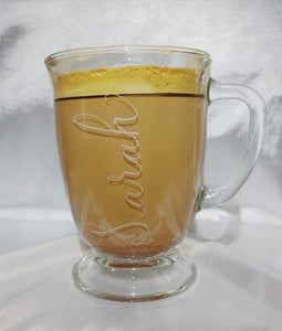 Engraved glass pedestal mug Sarah is written in a calligraphy font. All mugs are dishwasher safe and the font will not wash off as it is engraved directly into the glass