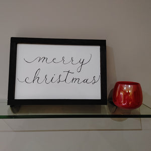 A classic home decor piece that is the perfect addition to your Christmas holiday setup.  This handcrafted sign is stained in your choice of frame colour and is made of solid wood.  Each sign is unique and hand written in a modern flowy calligraphy style " merry christmas"  14x10 inches with frame.