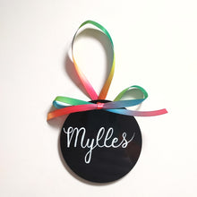 Load image into Gallery viewer, Each black acrylic ornament is a flat 4 inch round that can be personalized with a name or small phrase.  This sleek black is a classic style comes in your choice of ribbon and font colour.  4 inch round, 4mm thickness.

