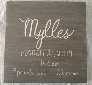  This 12x12 inch  wood sign is customized with your child’s name written in white calligraphy, birth date, time, weight, and length in grey stain colour. 