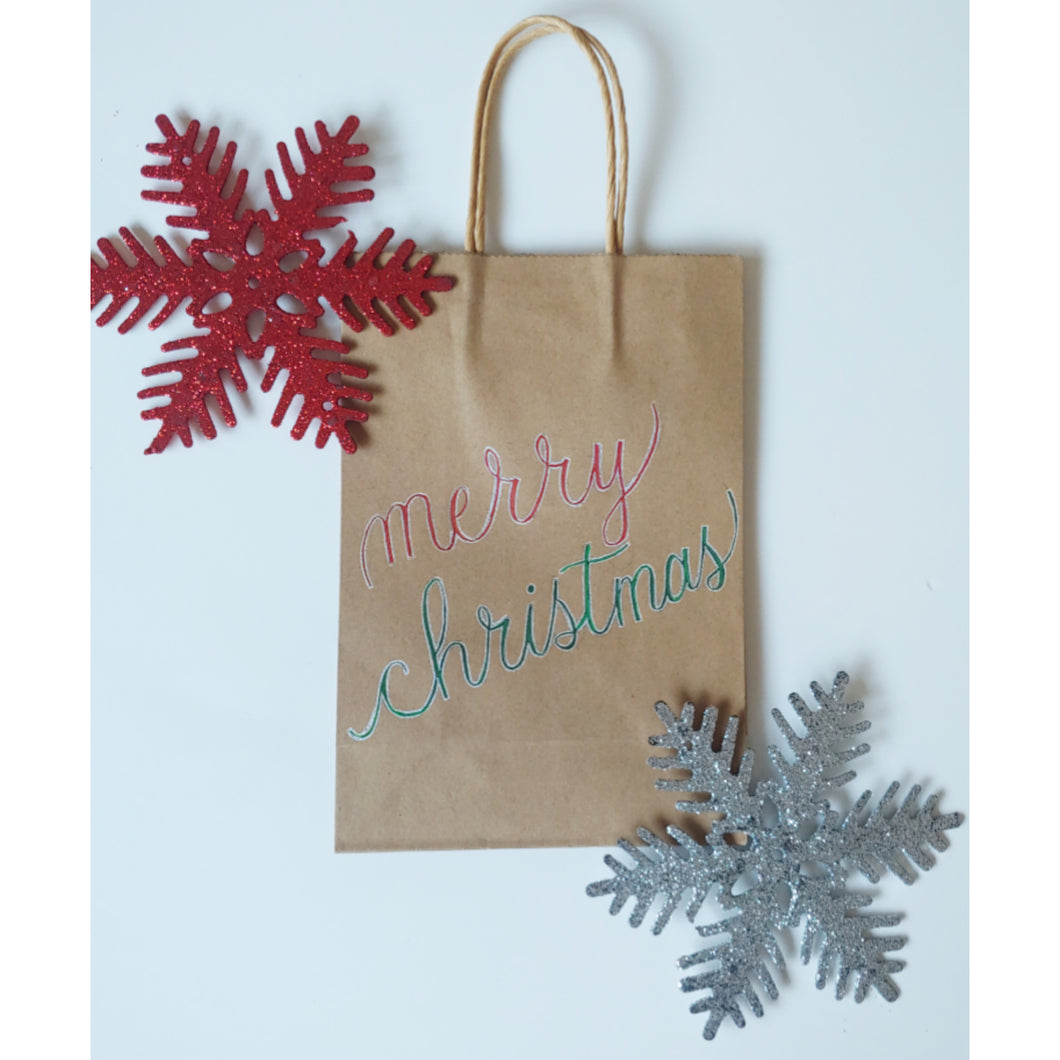 This Christmas gift bag is a cheery way for gift giving this holiday season.  Each kraft gift bag has 