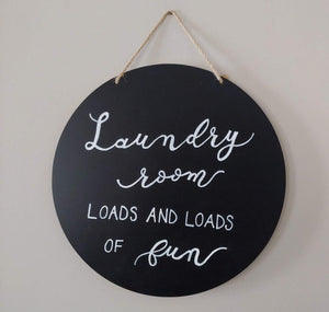 This is a fun home décor sign for your laundry room or the perfect gift for someone who has a dislike of laundry and a sense of humour about it.  "Loads and loads of fun" is hand-lettered in white  on an 11-inch (28 cm) round reversible chalkboard with wood backing.