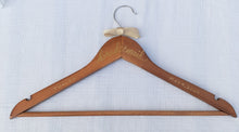 Load image into Gallery viewer, If you are looking for a perfect gift for your bridesmaid here is a custom hanger to accent her beautiful dress.  Wood hangers are hand-lettered with the bridesmaid&#39;s name and the wedding date. &quot;bridesmaid&quot; is written in calligraphy on the centre of the hanger, and the bridesmaid&#39;s name and your wedding date in block lettering with your choice of gold or chrome font colour.
