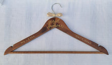 Load image into Gallery viewer, If you are looking for a perfect gift for your maid of honour here is a custom hanger to accent her beautiful dress.  Wood hangers are hand-lettered with the maid of honour’s name and the wedding date. &quot;maid of honour” is written in calligraphy on the centre of the hanger, and the maid of honour’s name and your wedding date in block lettering with your choice of gold or chrome font colour.
