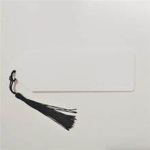 Load image into Gallery viewer, Do you have a book lover in your life and are looking for a thoughtful gift?  Each white acrylic bookmark can be personalized in your choice of font colour and includes a colourful tassel.  If you want extra sparkle can be customized with gold or silver flecks.    2x6 inches, 3mm thick

